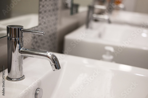 modern bathroom interior. white washbasin sink & chrome faucet