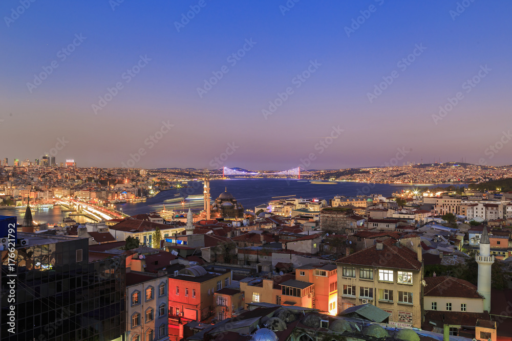 Istanbul view from down town of the city during the twilight with beatiful atmospheric blue sky and city lights