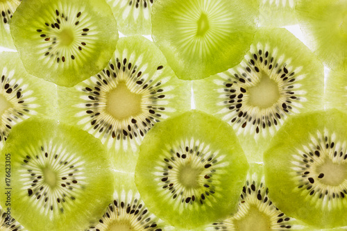 background of backlit kiwi slices