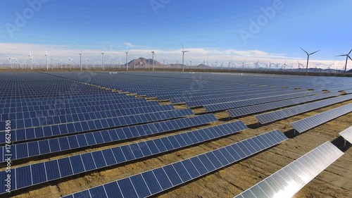 Solar panels, wind farm, renewable energy, drone view