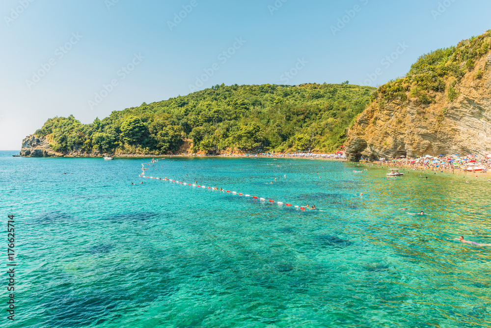 Fragment of Mogren beach in Budva, Montenegro is one of the most popular beaches on the Budva Riviera.