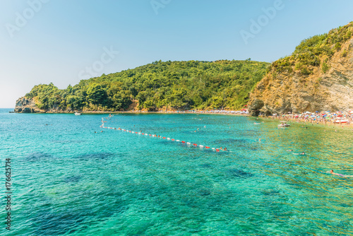 Fragment of Mogren beach in Budva, Montenegro is one of the most popular beaches on the Budva Riviera.