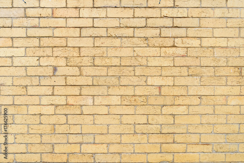 Background and texture of light color brick wall surface.