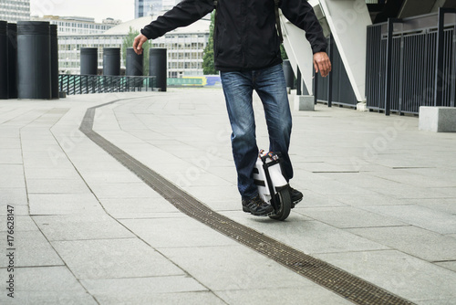man on self balancing one wheel scooter in the city © ninelutsk