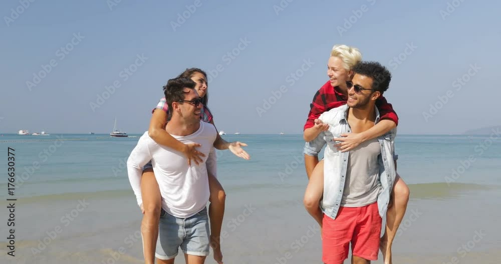 Men Carry Women On Back, Two Couples Walking On Beach Happy Cheerful People Talking Tourists On Vacation Slow Motion 60 Men Carry Women On Back, Two Couples Walking On Beach Happy Cheerful People Talking Tourists On Vacation Slow Motion 60
