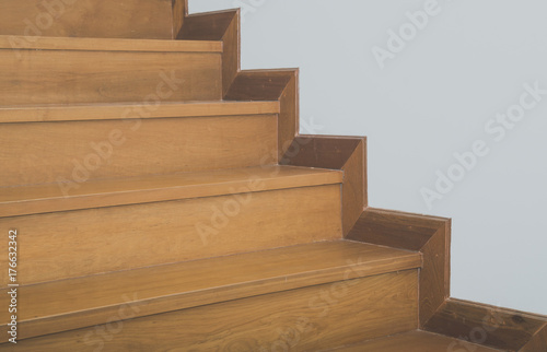 Wooden staircase and white wall