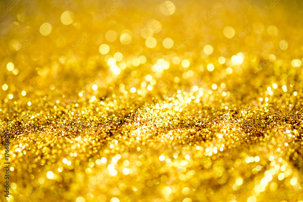 Gold dust powder sparkling glitter Abstract background texture Stock Photo
