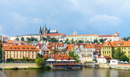 Prague Castle. The Charles Bridge. Medieval fortress. The Vltava River. Red tiled roofs. View from Charles Bridge