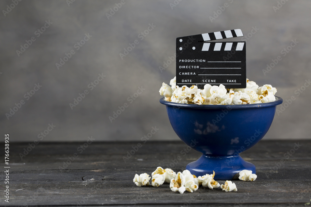 Naklejka premium Movie Clapper Board and Popcorn