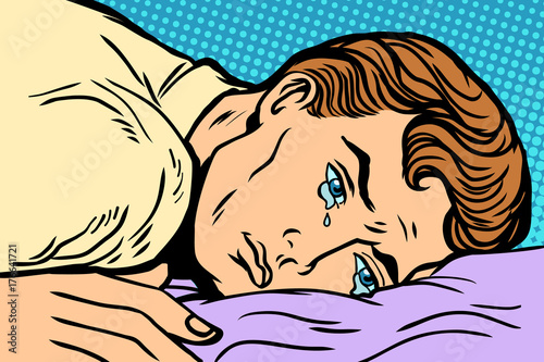man lying on bed, depression grief and sadness