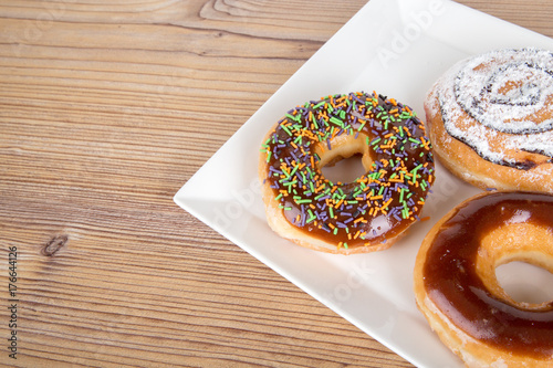 Yummy Donut on Wooden Background