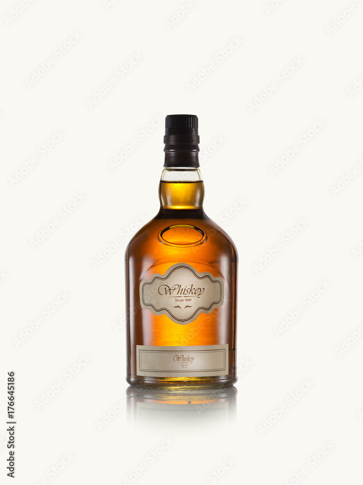 close up view of whiskey bottle on white back. self made label. close up view of whiskey bottle on white back. self made label.