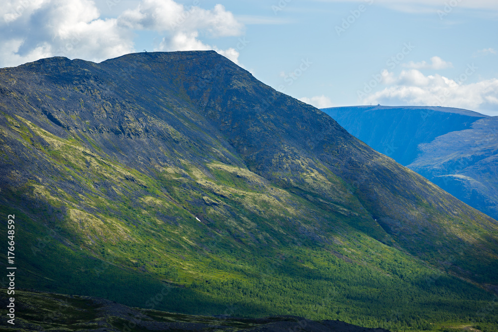 Fototapeta premium The tops of the Mountains, Khibiny and cloudy sky. Kola Peninsula, Russia.