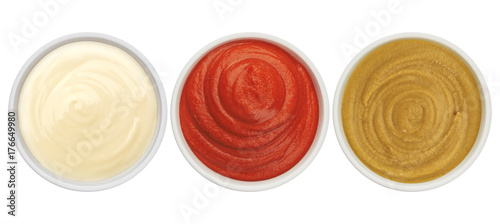 Ketchup, mayonnaise and mustard isolated on white background top view
