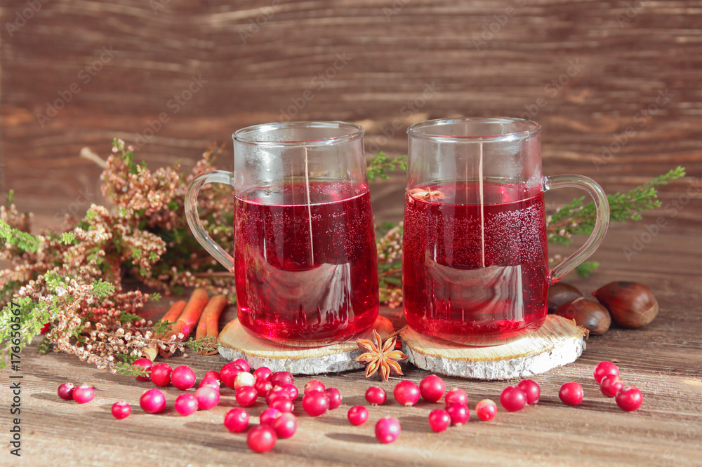 christmas drink, heather, spices, cranberries on a wooden background christmas drink, heather, spices, cranberries on a wooden background