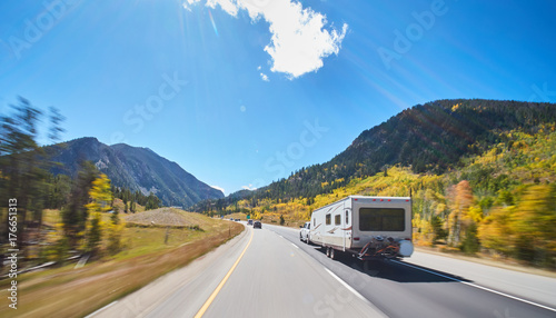 camper on road trip on road