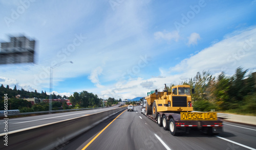 large freight truck on highway with oversize load