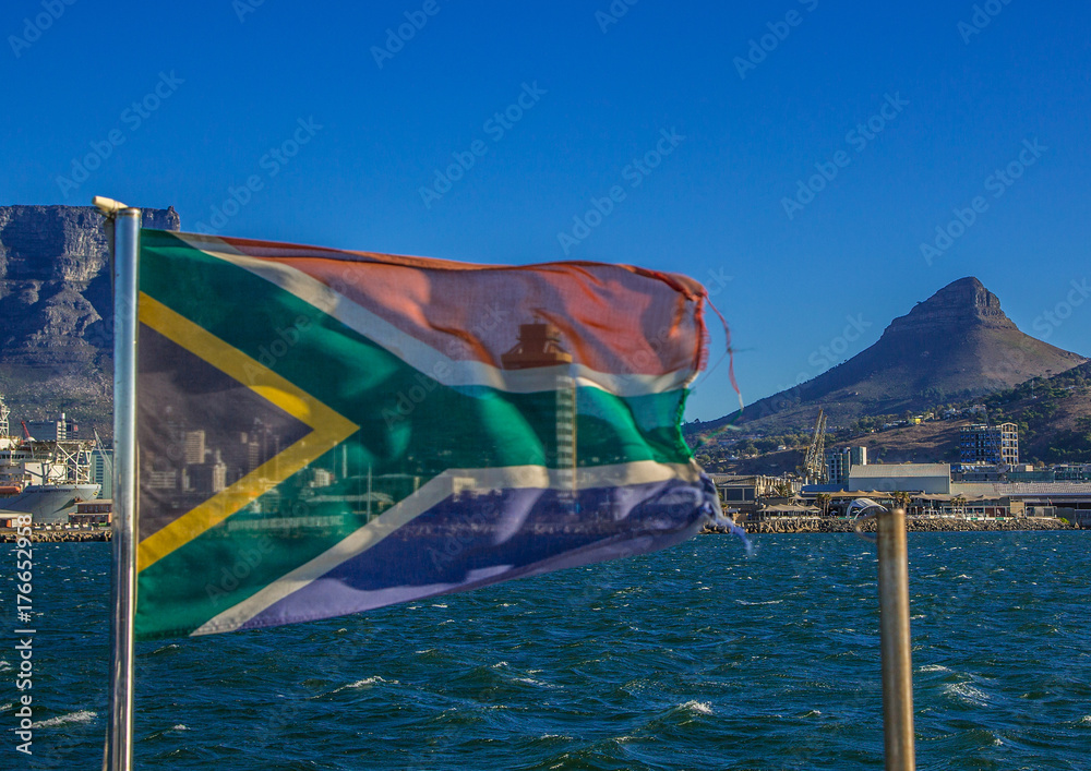 The flags of South Africa is blowing in the Wind in front of the Table Mountain in Cape Town in South Africa