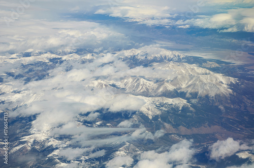 Snow-covered mountains viewed from airplane