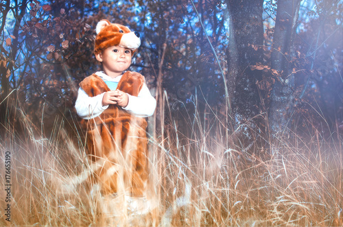Fototapeta Naklejka Na Ścianę i Meble -  child bear costume in the forest, very cute and funny