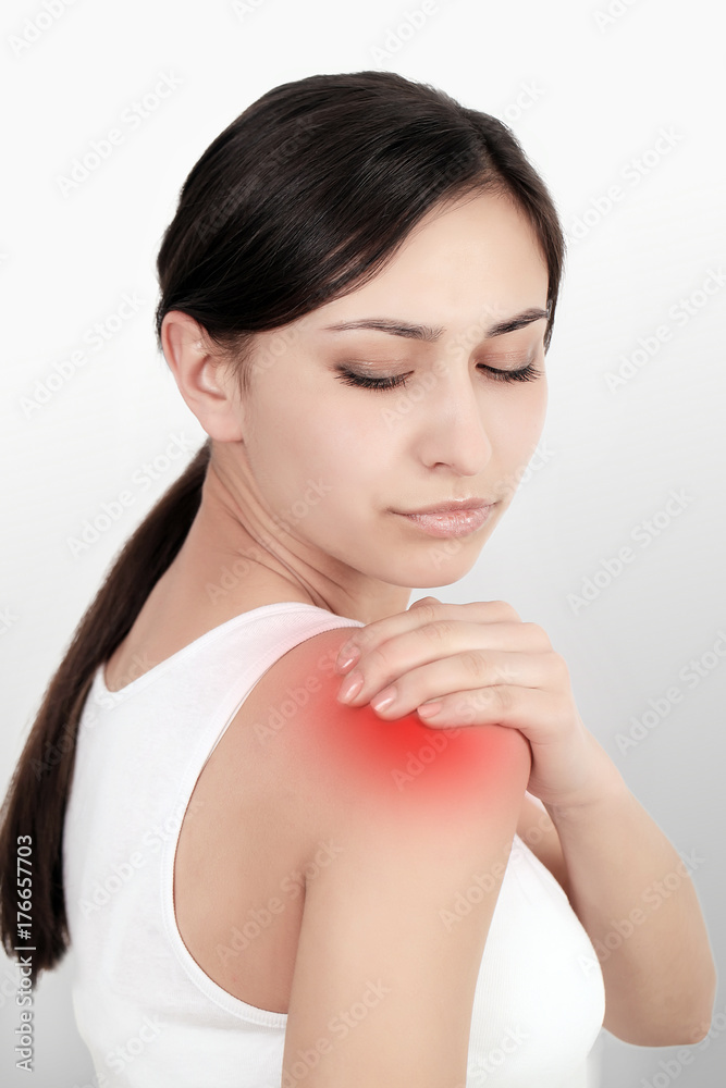 Woman with shoulder and shoulder pain. In the human body, the Concept