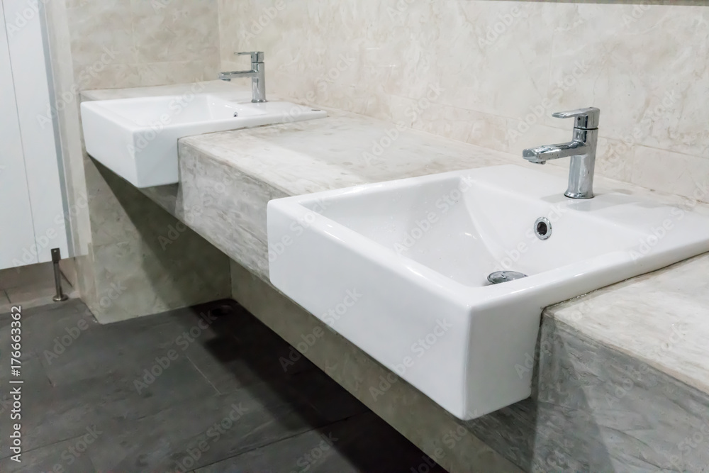 Fototapeta premium Minimal style bathroom with two sinks and granite top