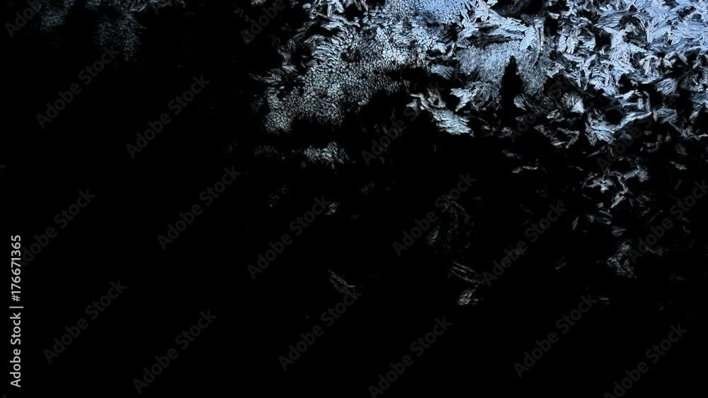 Beautiful window freezing animation from top to bottom, timelapse frost forming transition, natural crystal icing, isolated on black background with black and white luminance matte, alpha channel.