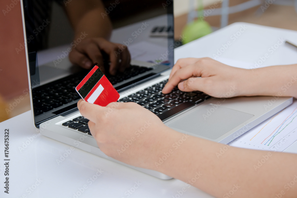 woman useing laptop and holding credit card with online shopping or internet banking online. woman useing laptop and holding credit card with online shopping or internet banking online.