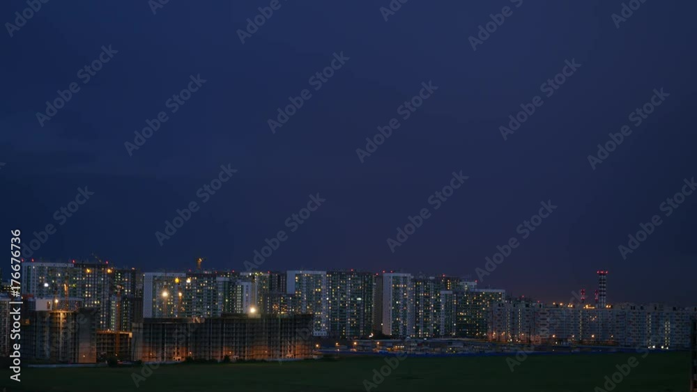 Night city scape, time laps. Thunderstorm clouds movin over dusk city Night city scape, time laps. Thunderstorm clouds movin over dusk city