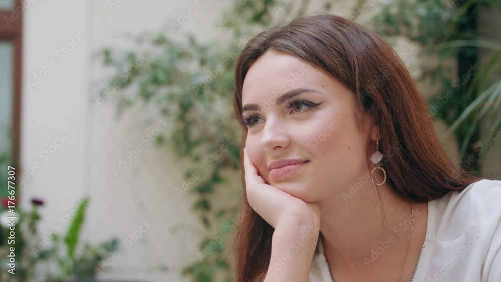 A beautiful girl sitting in the room. Closeup shot. Soft focus. A beautiful girl sitting in the room. Closeup shot. Soft focus.