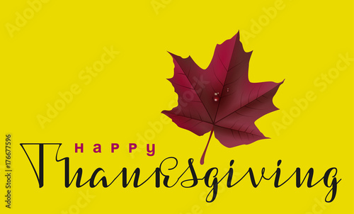 Happy Thanksgiving calligraphy text and autumn maple leaf. Greeting card for Thanksgiving Day