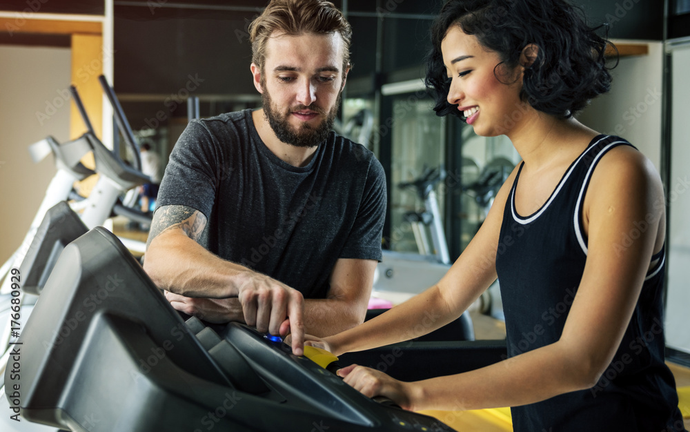 Couple working out together at the gym Couple working out together at the gym