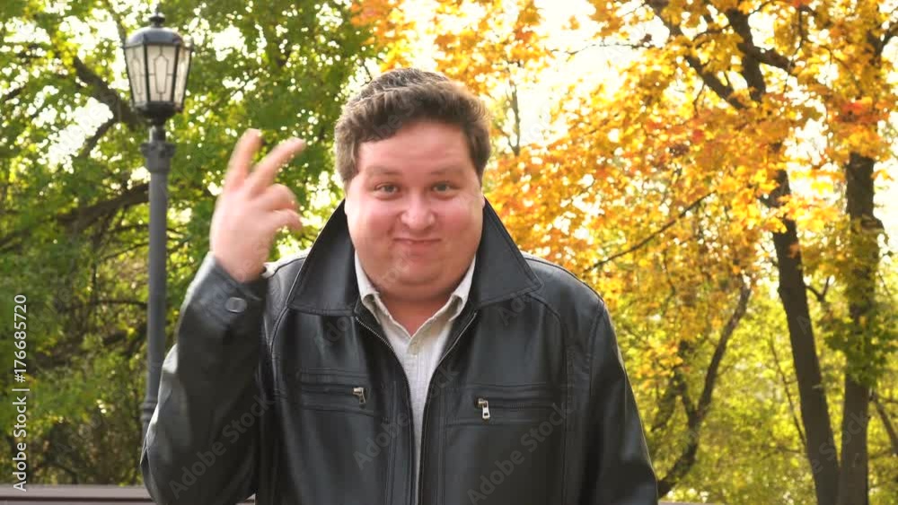 Man making crazy gesture on autumn park background Man making crazy gesture on autumn park background