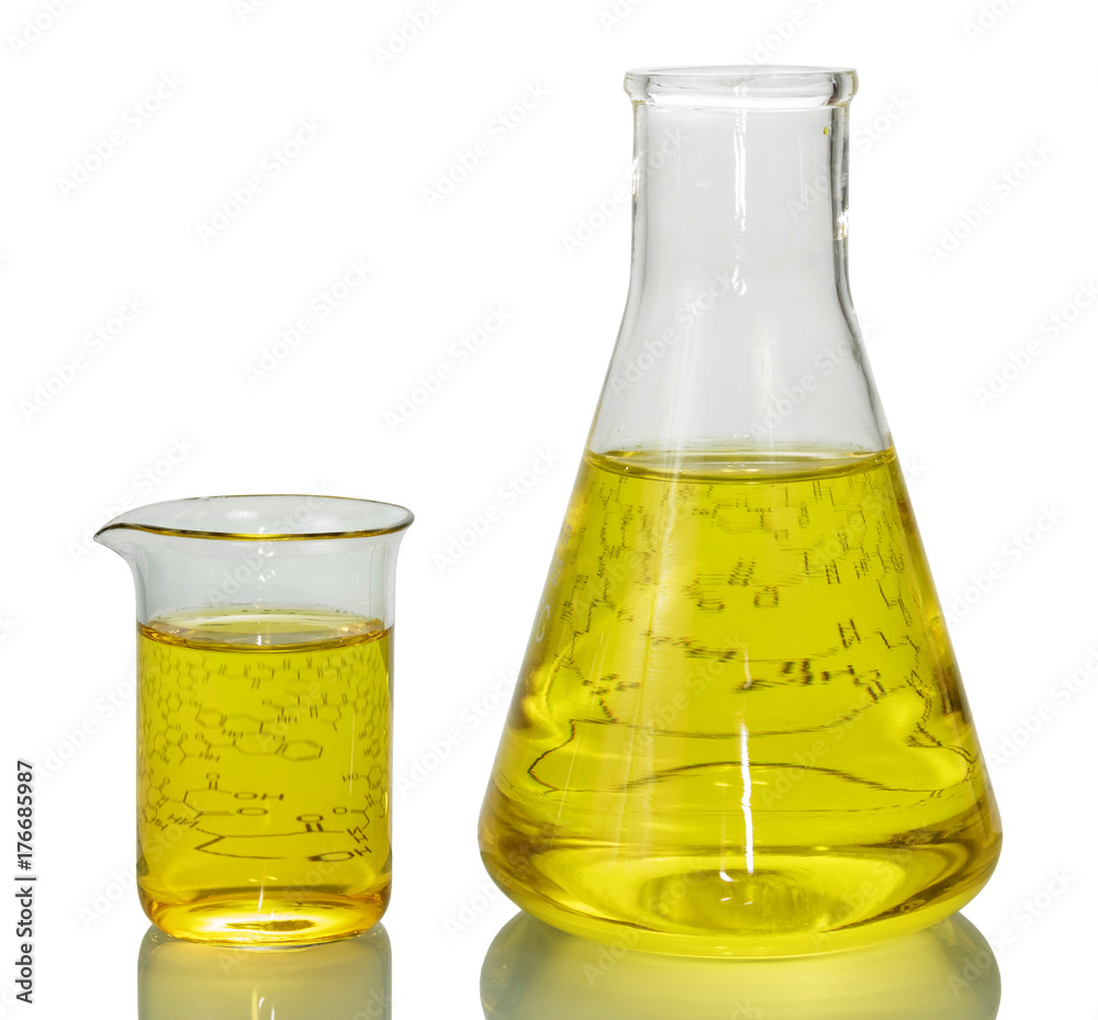A chemical flask, a beaker with yellow liquids and a sheet of paper with formulas isolated on white background. A chemical flask, a beaker with yellow liquids and a sheet of paper with formulas isolated on white background.