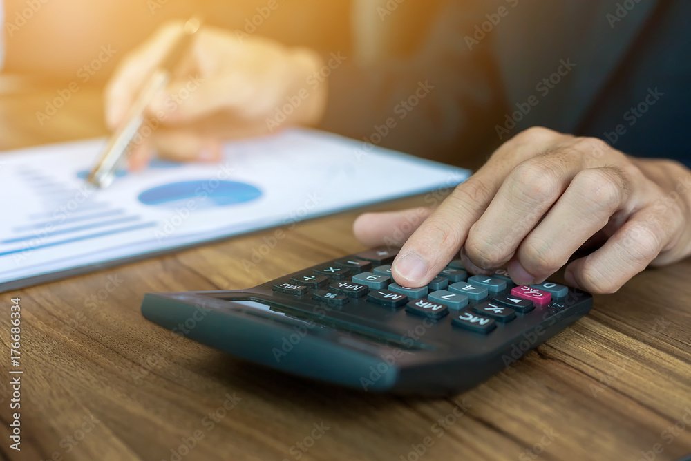 business are using hands press calculator. business are using hands press calculator.
