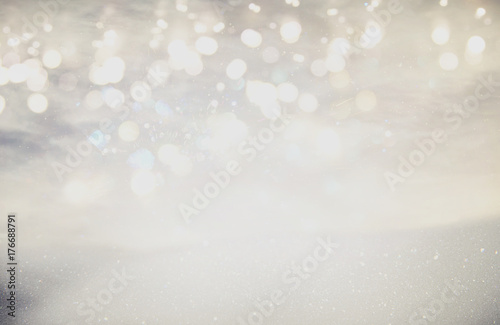 glitter vintage lights background. silver and light gold. de-focused © tomertu