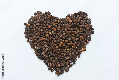 Coffee bean put in like heart on the white screen isolated © magneticmcc