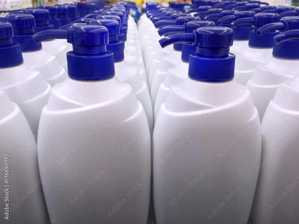 White Shampoo Bottles with Blue Dispensing Caps White Shampoo Bottles with Blue Dispensing Caps