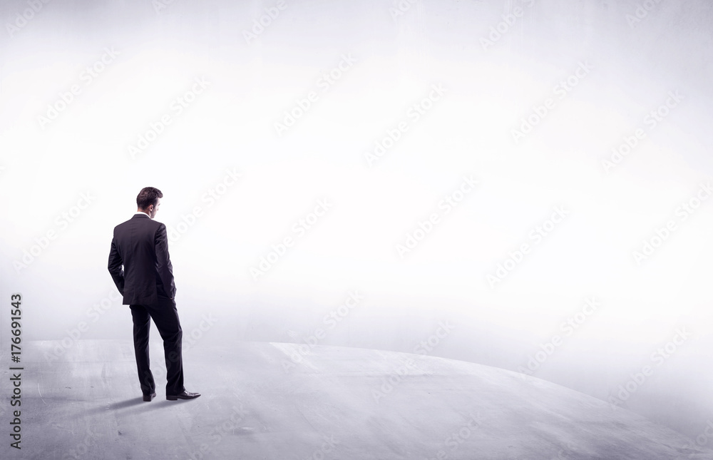 Business person standing from rear view Business person standing from rear view