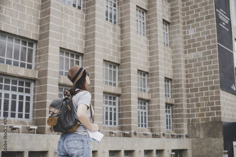 young women with backpack travel architecture location in thailand young women with backpack travel architecture location in thailand