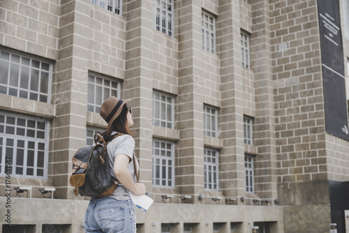 young women with backpack travel architecture location in thailand © Savelight Studio