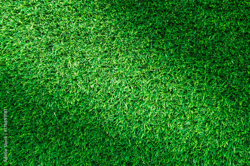 Fototapeta premium Artificial green grass texture for golf course. soccer field or sports background concept design.