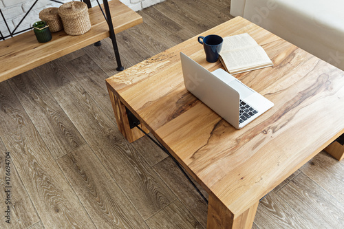 modern wooden table in the loft interior