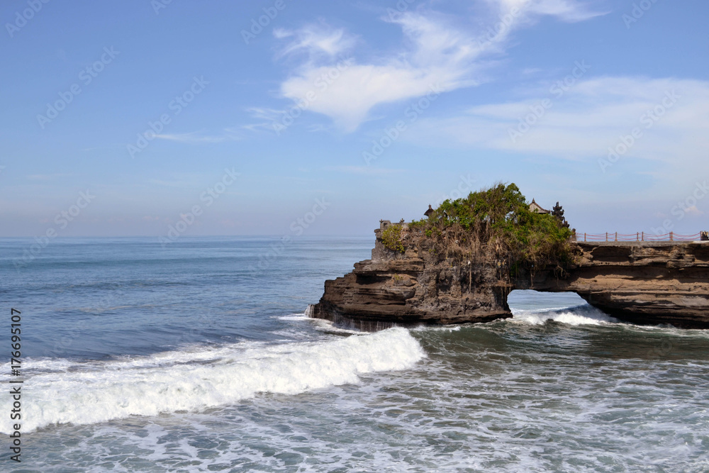 The temple by the sea, surrounded by waves crushing the rocks. Pic was taken in Tanah Lot, Bali The temple by the sea, surrounded by waves crushing the rocks. Pic was taken in Tanah Lot, Bali