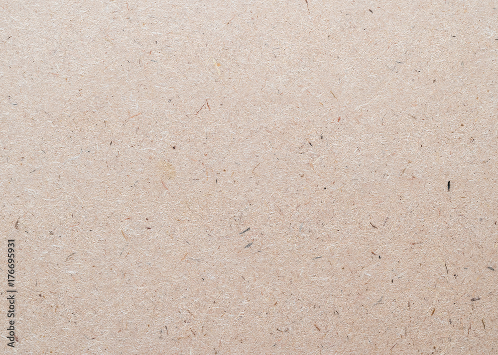 Beige particle pressed wood panel of oriented strand board (OSB) texture background in light brown cream sepia color .