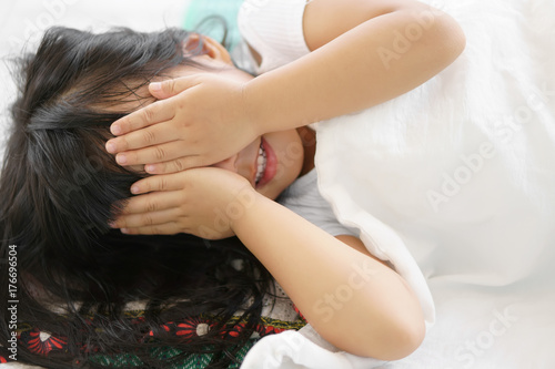 Tableau sur toile Asian children cute or kid girl sleep with hand close to eye for enjoy playing p