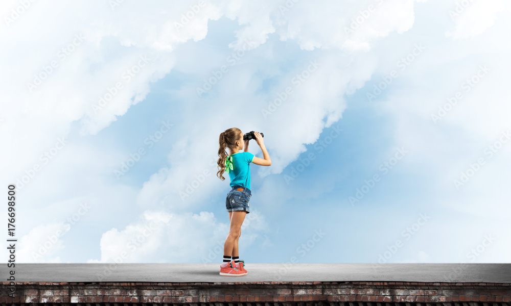 Concept of careless happy childhood with girl of school age looking in future Concept of careless happy childhood with girl of school age looking in future