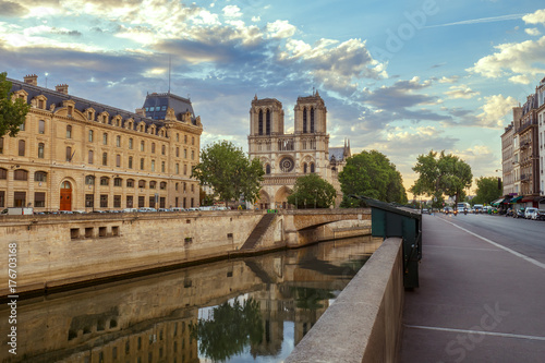 Notre Dame cathedral in Paris, France. Scenic view with river Seine. Summer travel background.