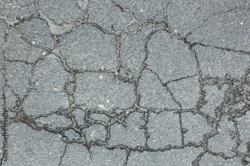 A dark crack on the background of a rocky surface.