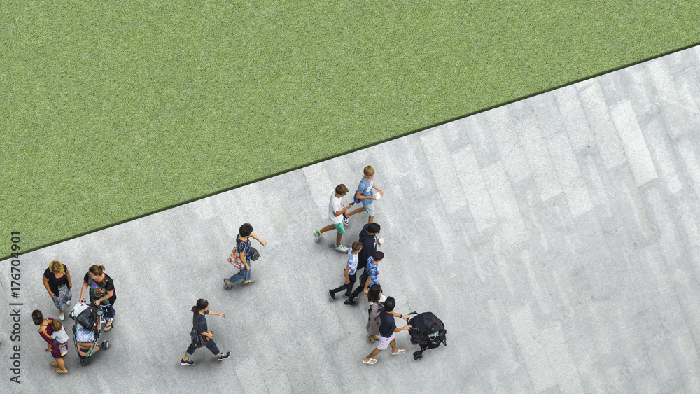 Obraz premium people walk on the pedestrian street walkway with the teenage young man and the group of family with little child with the greenfield landscape. (Aerial urban city photo)